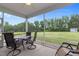 Inviting screened-in patio with comfortable seating and views of the spacious backyard at 206 Heart Pine Dr, Wendell, NC 27591