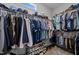 Organized walk-in closet with ample shelving and hanging space for clothes and shoes at 206 Heart Pine Dr, Wendell, NC 27591