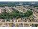Expansive aerial view of a neighborhood with tree-lined streets and well-maintained homes at 212 Fieldtrial Cir, Garner, NC 27529