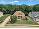 Aerial view of home and its front exterior, showcasing the lawn and landscaped areas at 212 Fieldtrial Cir, Garner, NC 27529