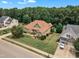 Aerial view of home shows the side-entry garage and well-manicured lawns at 212 Fieldtrial Cir, Garner, NC 27529