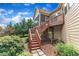 A cozy screened in porch is accessible by steps down to the backyard and the home's exterior at 212 Fieldtrial Cir, Garner, NC 27529