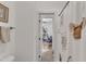 Bathroom doorway revealing a view into an adjacent room, offering a sense of space and flow at 212 Fieldtrial Cir, Garner, NC 27529