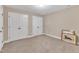 Carpeted bedroom with neutral paint, double closet, and an artistic wall decoration at 212 Fieldtrial Cir, Garner, NC 27529