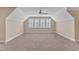 Bright, carpeted bonus room with a ceiling fan and window, providing natural light at 212 Fieldtrial Cir, Garner, NC 27529