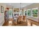 Dining area featuring fireplace, large windows offering abundant natural light at 212 Fieldtrial Cir, Garner, NC 27529