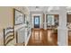 Elegant foyer with hardwood floors, detailed trim, and a view into the living spaces at 212 Fieldtrial Cir, Garner, NC 27529