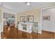 Spacious hallway with lovely hardwood floors, leading to inviting living spaces at 212 Fieldtrial Cir, Garner, NC 27529