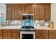 Kitchen featuring granite countertops, updated appliances, and ample cabinet space at 212 Fieldtrial Cir, Garner, NC 27529