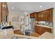 Well-lit kitchen with an island, stainless steel refrigerator, and plenty of counter space at 212 Fieldtrial Cir, Garner, NC 27529