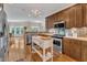 Kitchen featuring a center island, stainless steel appliances, and open layout at 212 Fieldtrial Cir, Garner, NC 27529