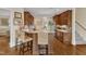Kitchen featuring an island with seating, granite countertops, and stainless steel appliances at 212 Fieldtrial Cir, Garner, NC 27529