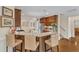 Kitchen island with seating, granite countertops, and stainless steel appliances at 212 Fieldtrial Cir, Garner, NC 27529