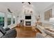Inviting living room features a fireplace and large windows offering natural light at 212 Fieldtrial Cir, Garner, NC 27529