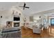 Comfortable living room showcases a fireplace and vaulted ceiling at 212 Fieldtrial Cir, Garner, NC 27529
