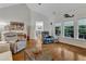 Open living room showcases hard wood floors and natural lighting at 212 Fieldtrial Cir, Garner, NC 27529