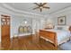 Open main bedroom boasting hardwood floors, tray ceiling, and ample space for seating and a dressing area at 212 Fieldtrial Cir, Garner, NC 27529