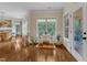 Bright sitting area with hardwood floors, large windows, and stylish decor at 212 Fieldtrial Cir, Garner, NC 27529