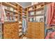 Custom walk-in closet with built-in shelving and drawers, offering ample storage space for clothes and accessories at 212 Fieldtrial Cir, Garner, NC 27529