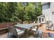 Well-designed back deck with space for dining and lounging, perfect for enjoying the wooded backyard at 215 Collinson Dr, Chapel Hill, NC 27514