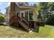 This backyard is the perfect spot for outdoor gatherings, complete with a deck and steps for easy access at 215 Collinson Dr, Chapel Hill, NC 27514