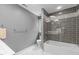 Modern bathroom features a shower-tub combo with gray tile surround at 215 Collinson Dr, Chapel Hill, NC 27514