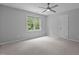 Neutral bedroom features a ceiling fan, and lots of natural light at 215 Collinson Dr, Chapel Hill, NC 27514