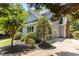 Exterior view of a well-maintained home with light blue siding and a manicured lawn at 215 Collinson Dr, Chapel Hill, NC 27514