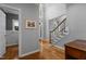 Welcoming foyer with hardwood floors, staircase, and chandelier at 215 Collinson Dr, Chapel Hill, NC 27514