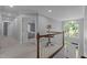 Upstairs hallway with view of foyer and chandelier at 215 Collinson Dr, Chapel Hill, NC 27514