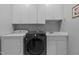 Functional laundry room with modern washer and dryer at 215 Collinson Dr, Chapel Hill, NC 27514
