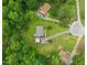 Aerial view of a neighborhood with tree-lined streets, well-maintained homes, and large lawns at 215 Virginia Pine Dr, Clayton, NC 27520