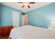 Light-filled bedroom features a large window, hardwood floors, and a full-sized bed at 215 Virginia Pine Dr, Clayton, NC 27520