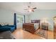 Bedroom with a vaulted ceiling, a wood-framed bed, and a large window at 215 Virginia Pine Dr, Clayton, NC 27520