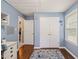 Charming bedroom with blue walls, white trim, a window, a closet, and hardwood floors at 215 Virginia Pine Dr, Clayton, NC 27520