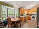 Charming kitchen with a bay window, wooden cabinetry, and ample countertop space at 215 Virginia Pine Dr, Clayton, NC 27520