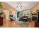 Cozy living room with hardwood floors, a ceiling fan, and a comfortable seating area at 215 Virginia Pine Dr, Clayton, NC 27520