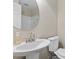 Modern bathroom featuring a pedestal sink, white fixtures, and subway tiled shower at 2423 Northern Bnd, Burlington, NC 27217