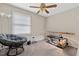 Comfortable bedroom with natural light, carpet flooring, ceiling fan, and space to relax at 2423 Northern Bnd, Burlington, NC 27217