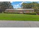 Charming brick ranch-style home with well-manicured lawn and mature trees at 2423 Northern Bnd, Burlington, NC 27217