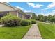 Brick ranch home with manicured bushes and inviting sidewalk at 2423 Northern Bnd, Burlington, NC 27217