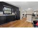 Kitchen with black cabinetry flowing to a living room at 2423 Northern Bnd, Burlington, NC 27217