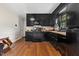 Modern kitchen with sleek black cabinets and granite countertops at 2423 Northern Bnd, Burlington, NC 27217