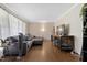 Cozy living room with hardwood floors and comfortable gray sectional at 2423 Northern Bnd, Burlington, NC 27217
