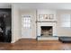 Bright living room featuring a fireplace, hardwood floors, and neutral paint at 2423 Northern Bnd, Burlington, NC 27217
