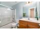 Bathroom with a shower-tub combo, toilet, and single sink vanity at 25 Spicetree Ct, Youngsville, NC 27596