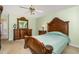 Spacious primary bedroom with detailed wood furniture and a ceiling fan at 25 Spicetree Ct, Youngsville, NC 27596