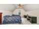 Spacious bedroom with two beds, a ceiling fan, and a built-in desk at 25 Spicetree Ct, Youngsville, NC 27596