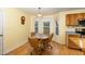 Eat-in nook features natural light from bay window and hardwood floors at 25 Spicetree Ct, Youngsville, NC 27596