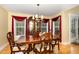 Dining room featuring hardwood floors and large window for natural light at 25 Spicetree Ct, Youngsville, NC 27596